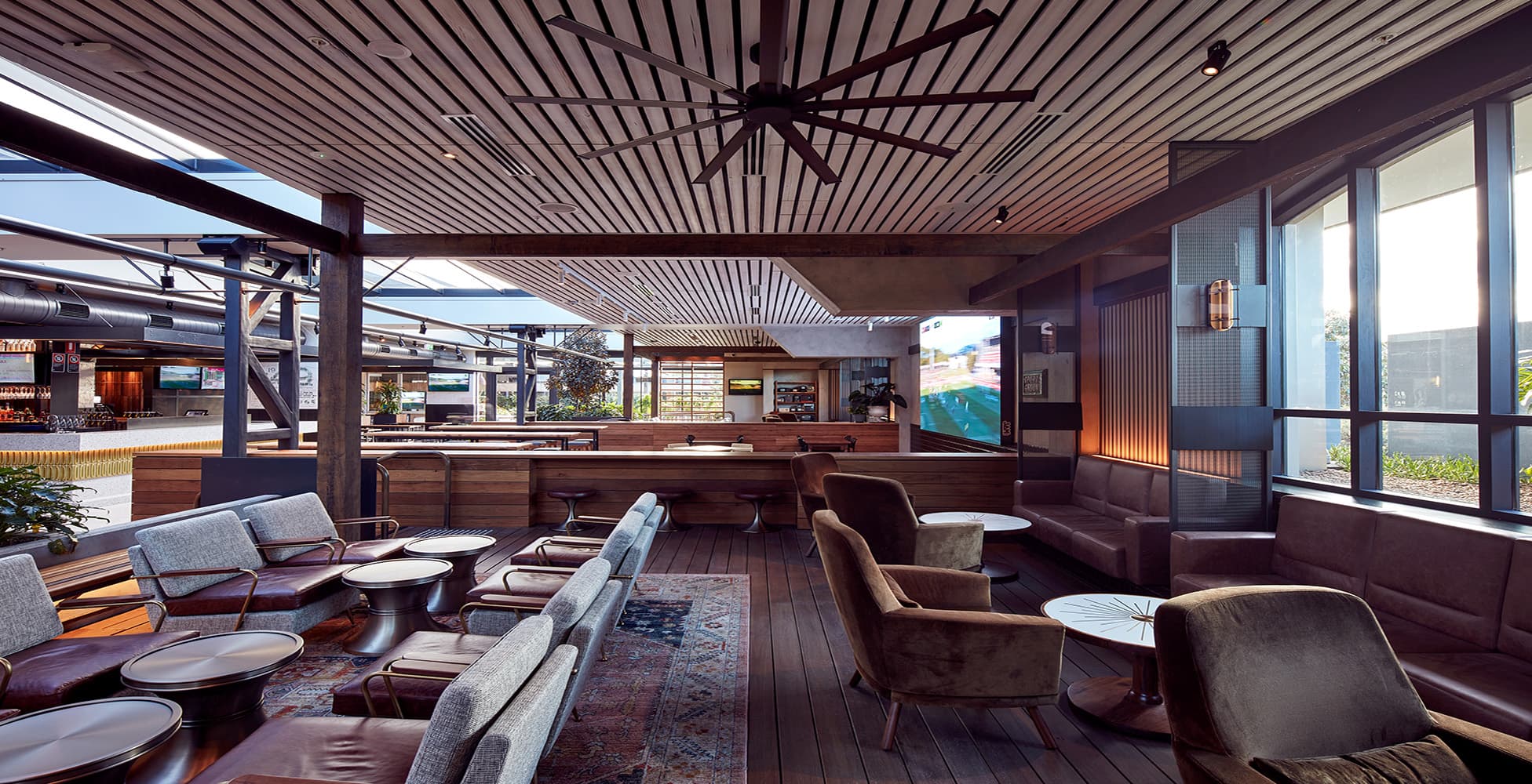 The Battery House sports bar at Dee Why RSL, designed by Altis Architecture, featuring a contemporary fit-out with feature lighting and bar seating.