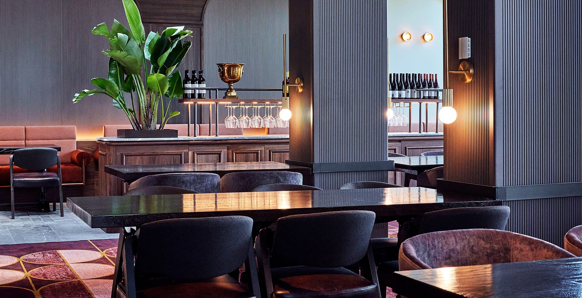 Interior detail of Flame restaurant at Dee Why RSL, showing the sophisticated material palette and atmospheric lighting designed by Altis Architecture.